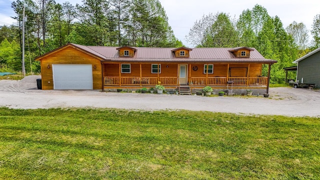 663 John R Jones Rd, London, KY 40741 - chalet / cabin with a porch, metal roof, an attached garage, and a front yard