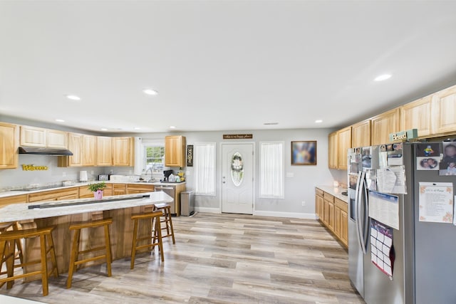 663 John R Jones Rd, London, KY 40741 - kitchen with appliances with stainless steel finishes, light brown cabinetry, light countertops, light wood finished floors, and recessed lighting