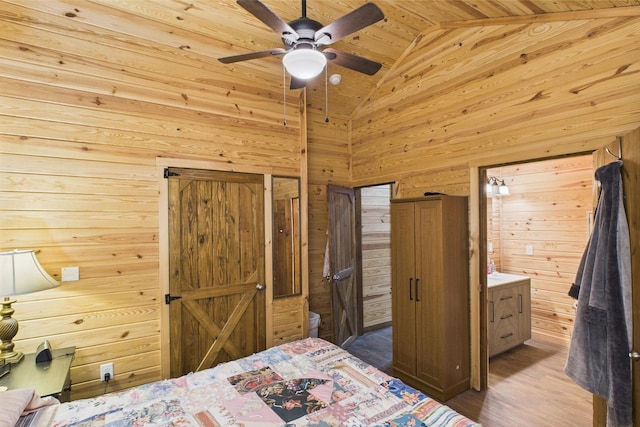 663 John R Jones Rd, London, KY 40741 - bedroom with lofted ceiling, wooden walls, wood finished floors, wooden ceiling, and ceiling fan