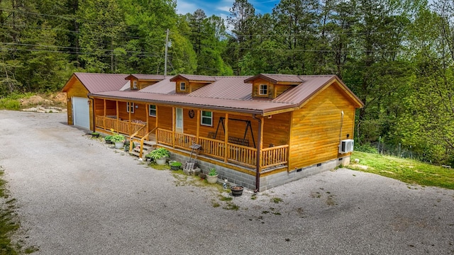 663 John R Jones Rd, London, KY 40741 - rustic home featuring a porch, crawl space, metal roof, and a garage