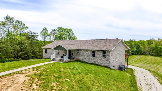 663 John R Jones Rd, London, KY 40741 - single story home featuring a front yard, central air condition unit, and brick siding