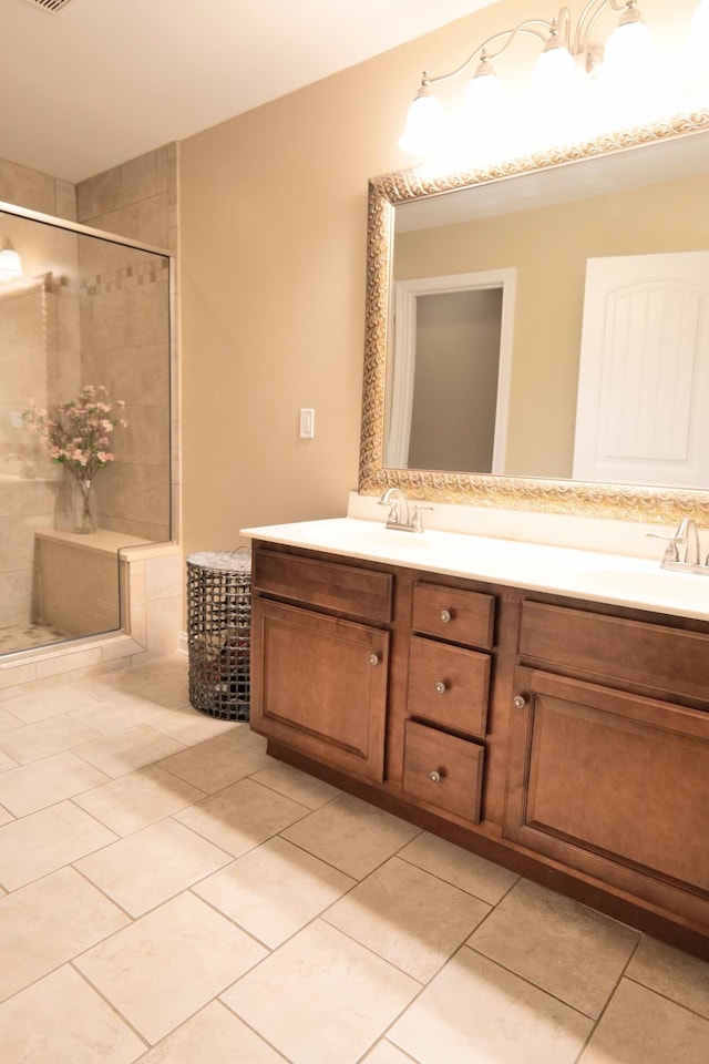bathroom with tile patterned flooring, double vanity, and a stall shower
