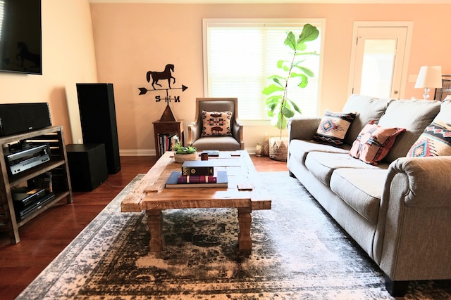 living room with dark wood-style flooring and baseboards