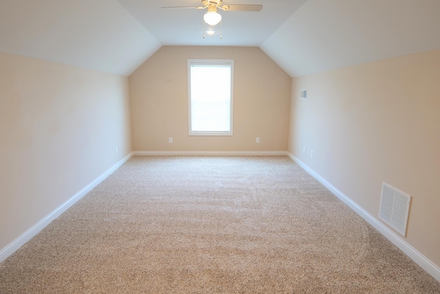 bonus room with carpet, ceiling fan, lofted ceiling, and baseboards