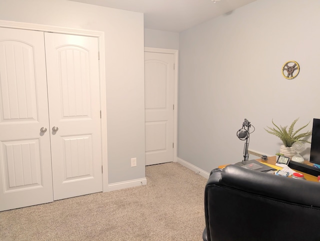 office space with light colored carpet and baseboards
