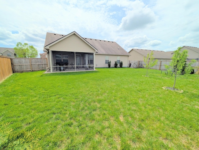 back of property with a sunroom