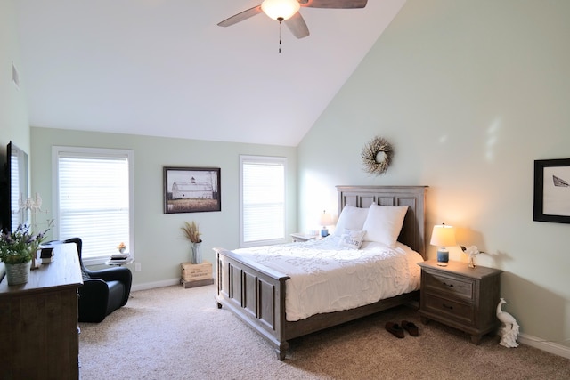 carpeted bedroom featuring multiple windows, baseboards, lofted ceiling, and ceiling fan