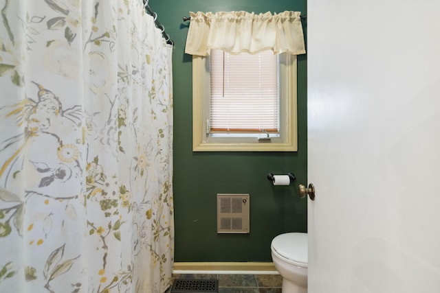 429 Old Danville Rd, Lancaster, KY 40444 - bathroom with toilet, baseboards, heating unit, tile patterned floors, and a shower with shower curtain