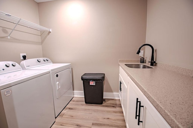 63 Liam Way, Paint Lick, KY 40461 - washroom with washer and clothes dryer, light wood-style floors, baseboards, and cabinet space
