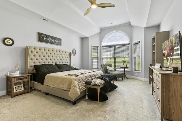 bedroom with baseboards, lofted ceiling, light colored carpet, and ceiling fan