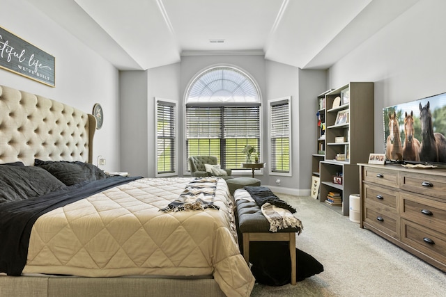 bedroom with light carpet, lofted ceiling, baseboards, and crown molding