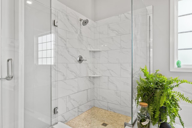 full bath with a shower stall