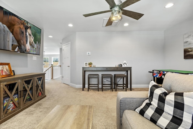 carpeted living room with baseboards, recessed lighting, and a ceiling fan