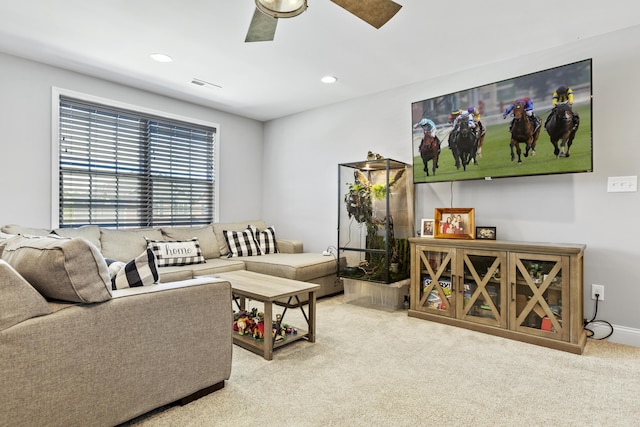living room with carpet, a ceiling fan, and recessed lighting
