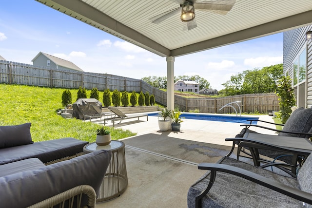 view of patio with ceiling fan, an outdoor living space, and grilling area