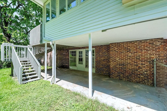 view of patio featuring stairs and an attached carport