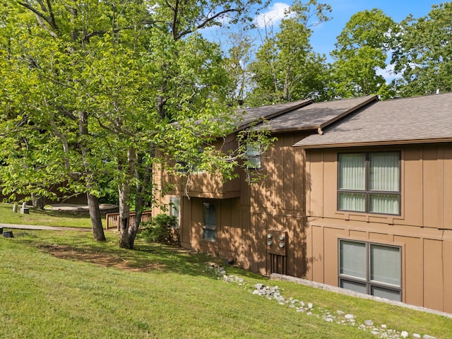 18-2 Woodson Bend Resort, Bronston, KY 42518 - view of side of home featuring a lawn and a shingled roof