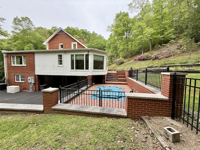 118 Timber Ln, Morehead, KY 40351 - rear view of house featuring a deck, brick siding, and central AC unit