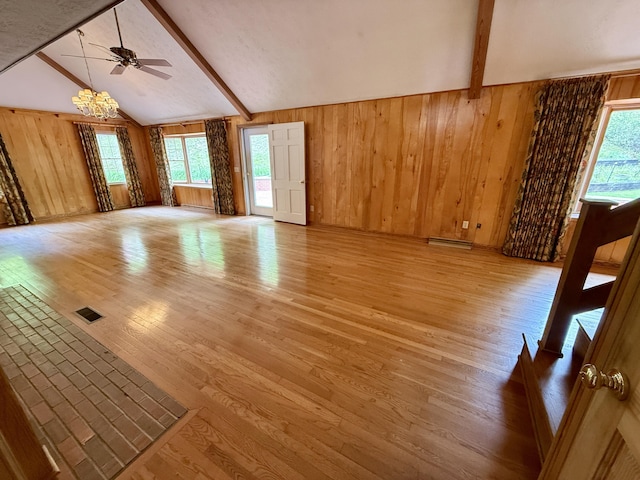 118 Timber Ln, Morehead, KY 40351 - unfurnished living room featuring wood walls, light wood finished floors, a chandelier, and ceiling fan