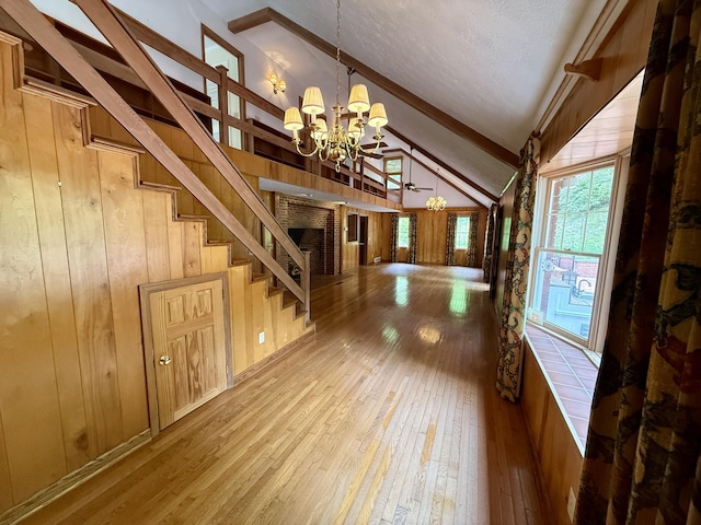 118 Timber Ln, Morehead, KY 40351 - foyer entrance with hardwood / wood-style flooring, a chandelier, wooden walls, stairway, and a fireplace