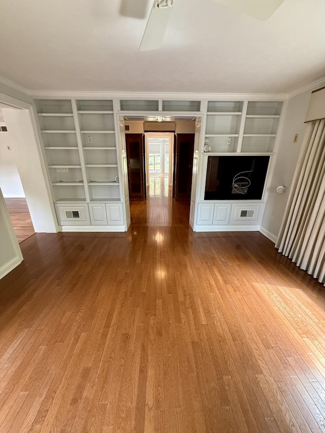 118 Timber Ln, Morehead, KY 40351 - unfurnished living room featuring built in shelves, wood-type flooring, ceiling fan, and ornamental molding