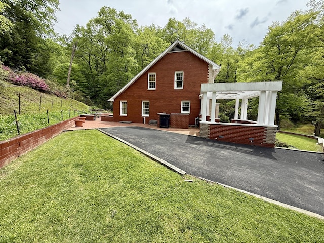 118 Timber Ln, Morehead, KY 40351 - view of property exterior with a pergola, a patio area, and brick siding