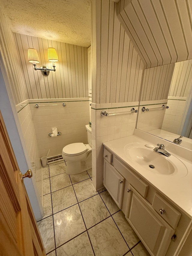 118 Timber Ln, Morehead, KY 40351 - bathroom featuring vanity, toilet, wood walls, and a textured ceiling