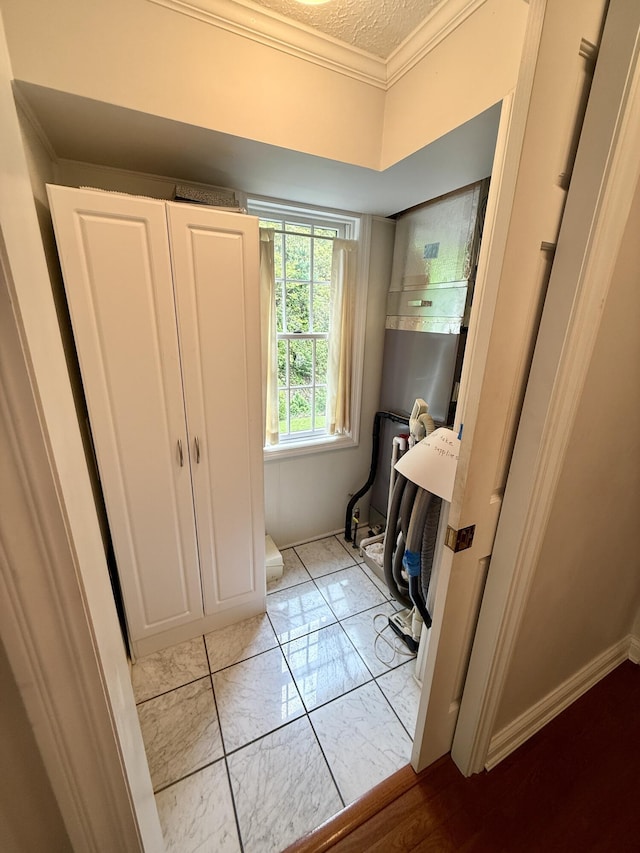 118 Timber Ln, Morehead, KY 40351 - bathroom featuring marble finish floors, crown molding, a textured ceiling, and baseboards