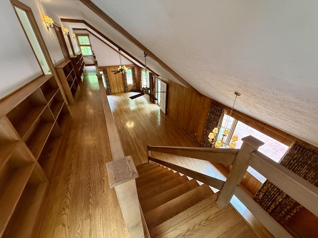 118 Timber Ln, Morehead, KY 40351 - staircase featuring wood finished floors, lofted ceiling, ceiling fan, and wood walls
