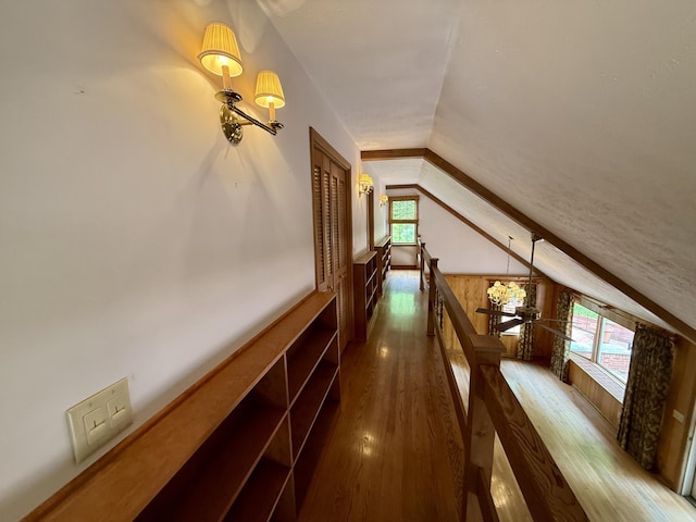 118 Timber Ln, Morehead, KY 40351 - hall featuring an upstairs landing, lofted ceiling, wood finished floors, a chandelier, and wooden walls