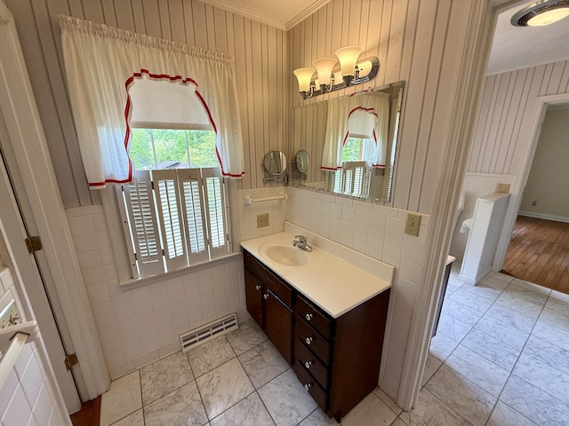 118 Timber Ln, Morehead, KY 40351 - bathroom featuring ornamental molding, vanity, marble finish floors, tile walls, and wainscoting