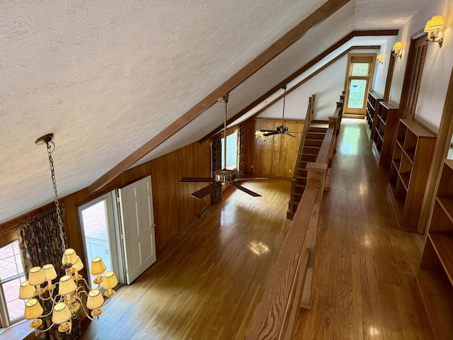 118 Timber Ln, Morehead, KY 40351 - bonus room with a textured ceiling, vaulted ceiling, hardwood / wood-style flooring, a ceiling fan, and a chandelier