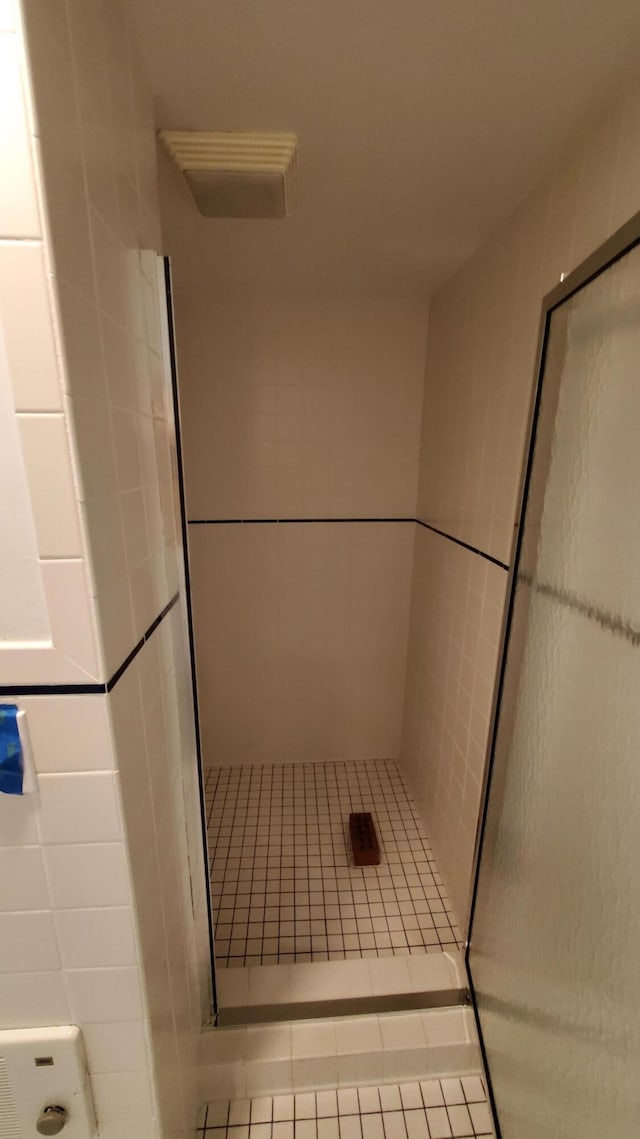 118 Timber Ln, Morehead, KY 40351 - bathroom with a shower stall, tile patterned flooring, and tile walls