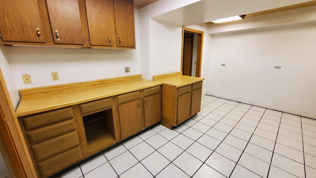 118 Timber Ln, Morehead, KY 40351 - kitchen featuring light countertops, brown cabinets, and light tile patterned floors