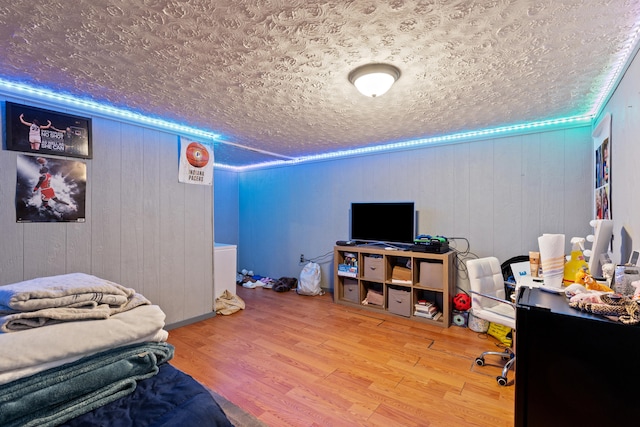 285 W Railroad St, Stanton, KY 40380 - bedroom featuring wood finished floors, a textured ceiling, and wooden walls