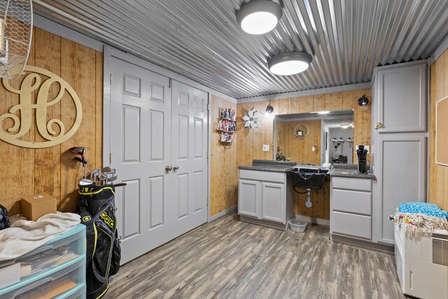 285 W Railroad St, Stanton, KY 40380 - kitchen with wood finished floors, wood walls, white cabinets, wood ceiling, and dark countertops