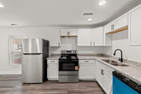 426 Cardwell Ave, Harrodsburg, KY 40330 - kitchen with stainless steel appliances, a sink, recessed lighting, light stone countertops, and white cabinets