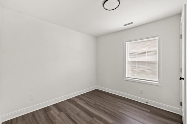 426 Cardwell Ave, Harrodsburg, KY 40330 - spare room featuring dark wood finished floors and baseboards