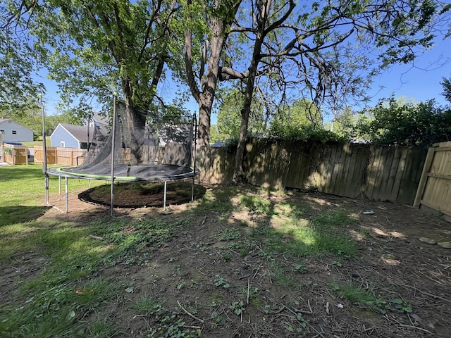 view of yard with a trampoline