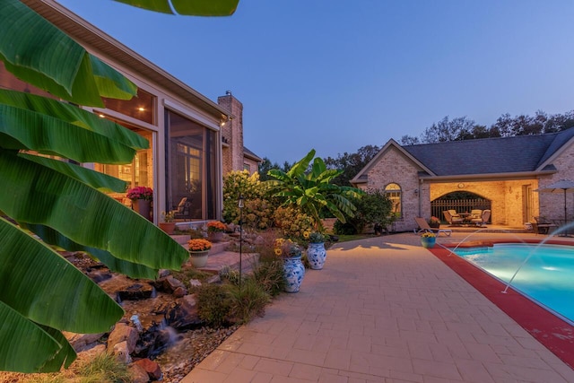 150 Old Woods Dr, Nicholasville, KY 40356 - view of swimming pool featuring a patio and a sunroom