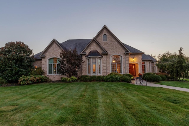 150 Old Woods Dr, Nicholasville, KY 40356 - french country inspired facade featuring a yard and brick siding