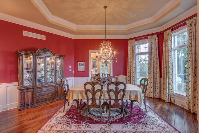 150 Old Woods Dr, Nicholasville, KY 40356 - dining area with a tray ceiling, a chandelier, wainscoting, wood-type flooring, and crown molding