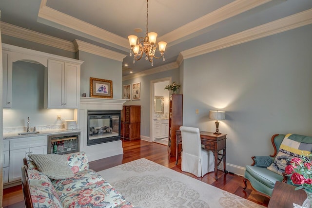150 Old Woods Dr, Nicholasville, KY 40356 - living area with beverage cooler, dark wood-type flooring, baseboards, a raised ceiling, and a chandelier
