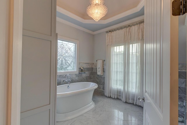 150 Old Woods Dr, Nicholasville, KY 40356 - full bathroom with plenty of natural light, a soaking tub, tile walls, a chandelier, and ornamental molding