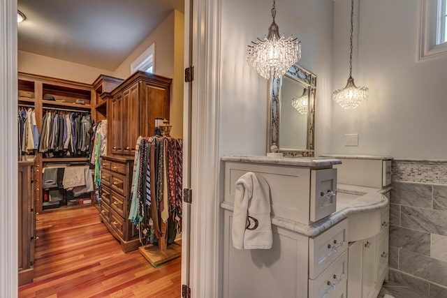 150 Old Woods Dr, Nicholasville, KY 40356 - walk in closet featuring a chandelier and light wood-type flooring