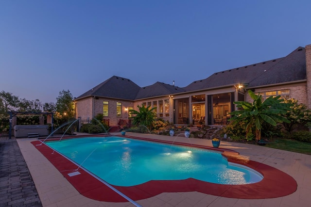 150 Old Woods Dr, Nicholasville, KY 40356 - pool at dusk with a hot tub, a patio, and an outdoor pool