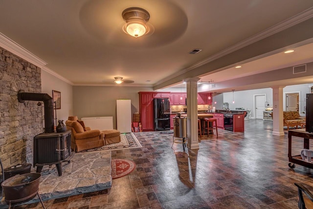150 Old Woods Dr, Nicholasville, KY 40356 - living area featuring ornamental molding, ornate columns, and a wood stove