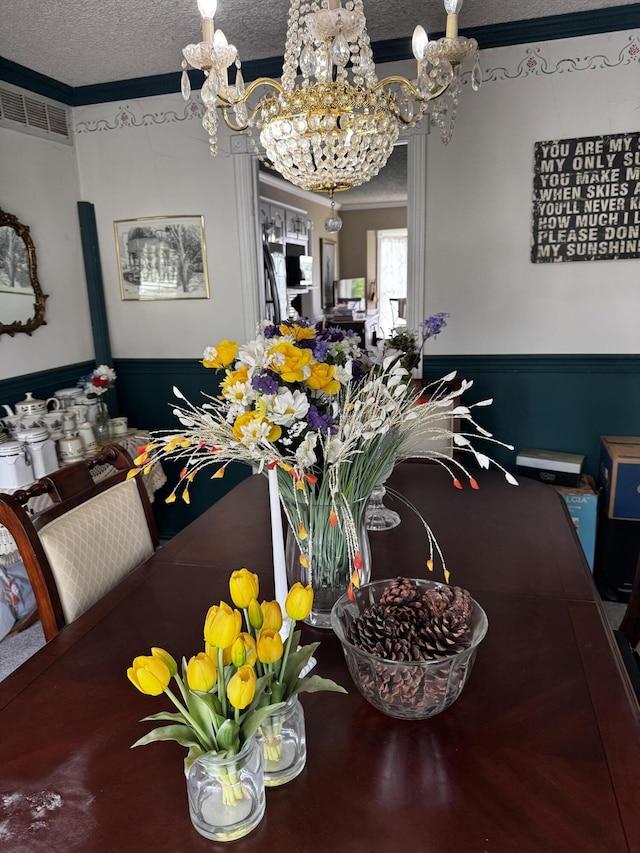 400 Natures Pointe Dr, Somerset, KY 42503 - dining space featuring a chandelier, a textured ceiling, crown molding, and wainscoting