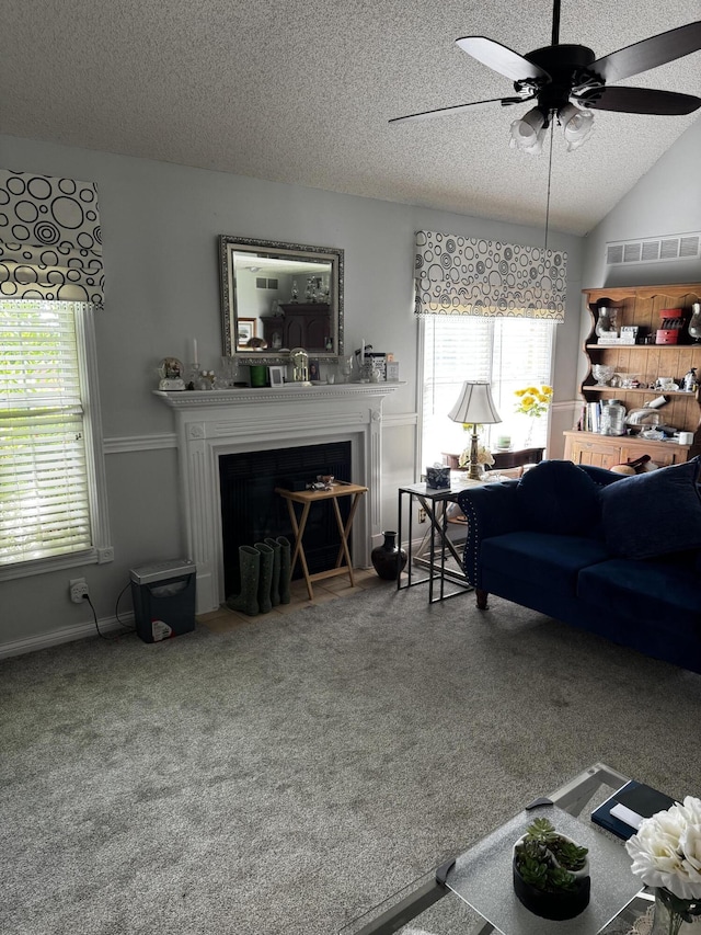 400 Natures Pointe Dr, Somerset, KY 42503 - living area featuring a fireplace with flush hearth, a textured ceiling, carpet flooring, a ceiling fan, and healthy amount of natural light