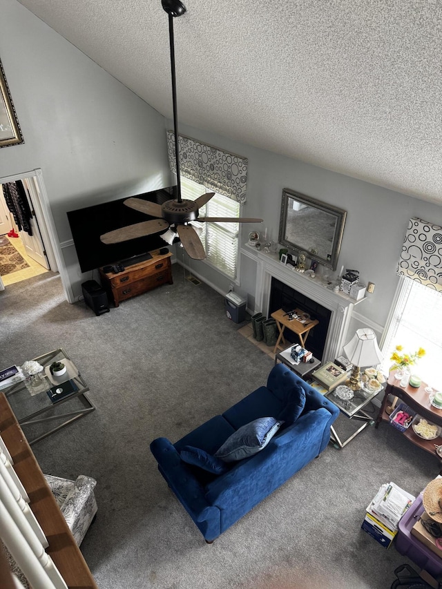 400 Natures Pointe Dr, Somerset, KY 42503 - living room with a textured ceiling, plenty of natural light, a fireplace with flush hearth, carpet, and a ceiling fan